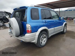 2004 Suzuki Grand Vitara with VIN JS3TE62V544100539, listed as a IAAI auction lot 41900314 with 192,776 mi miles. Bid and sale history available at carsss.com. Image 4.