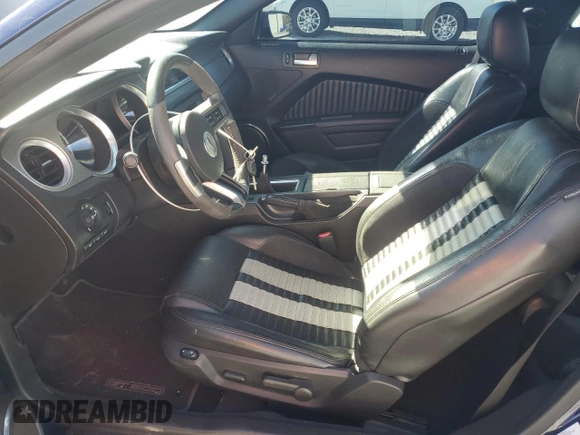 2010 Ford Mustang GT500 with VIN 1ZVBP8JS1A5105926, listed as a Copart auction lot 77398504 with 63,699 mi miles and Salvage title. Bid and sale history available at DreamBid. Image 7.