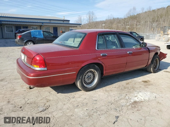 2001 Ford Crown Victoria LX z VIN 2FAFP74W41X205147, wystawiony jako Copart lot #46240035 z przebiegiem 65 495 mil mil oraz Szkoda całkowita • Salvage title. Historia ofert i sprzedaży dostępna na DreamBid. Obrazek 3.