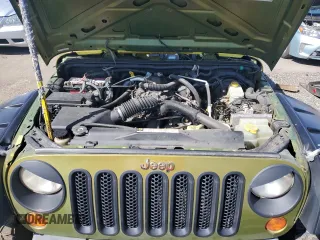 2008 Jeep Wrangler Unlimited X with VIN 1J4GA39118L528479, listed as a Copart auction lot 50953825 with 171,156 mi miles and Salvage Title. Bid and sale history available at carsss.com. Image 12.