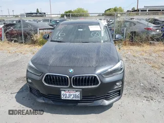 2019 BMW X2 sDrive28i with VIN WBXYJ3C58KEP77334, listed as a IAAI auction lot 42575165 with 98,910 mi miles and . Bid and sale history available at DreamBid. Image 12.