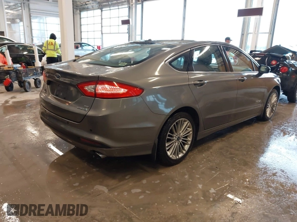 2014 Ford Fusion SE Hybrid with VIN 3FA6P0LU5ER310629, listed as a IAAI auction lot 41941852 with 53,739 mi miles. Bid and sale history available at carsss.com. Image 4.