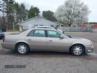2002 Cadillac DeVille z VIN 1G6KD54Y32U108623, wystawiony jako IAAI lot #41957171 z przebiegiem 136 941 mil mil oraz . Historia ofert i sprzedaży dostępna na DreamBid. Obrazek 13.