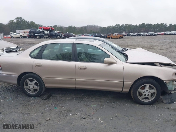 1997 Toyota Avalon XL with VIN 4T1BF12B1VU198756, listed as a IAAI auction lot 41613887 with 217,863 mi miles. Bid and sale history available at carsss.com. Image 13.