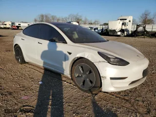 2021 Tesla Model 3 Standard Range Plus with VIN 5YJ3E1EA9MF100403, listed as a Copart auction lot 48561545 with 68,996 mi miles and Salvage Title. Bid and sale history available at carsss.com. Image 4.