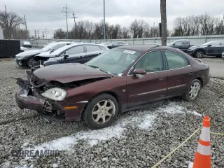 2000 Mercury Sable LS Premium with VIN 1MEFM55S9YG645964, listed as a Copart auction lot 84146394 with 162,865 mi miles and Salvage Title. Bid and sale history available at carsss.com. Image 1.