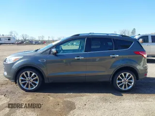 2015 Ford Escape SE with VIN 1FMCU9G97FUA89251, listed as a IAAI auction lot 41919240 with 148,472 mi miles and . Bid and sale history available at DreamBid. Image 14.