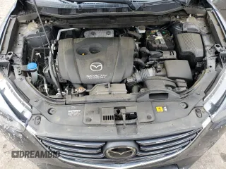 2016 Mazda CX-5 Grand Touring z VIN JM3KE4DY5G0741800, wystawiony jako Copart lot #58565455 z przebiegiem 33 675 mil mil oraz Szkoda całkowita • Salvage title. Historia ofert i sprzedaży dostępna na DreamBid. Obrazek 12.