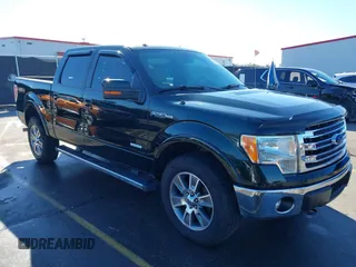 2014 Ford F-150 XL with VIN 1FTFW1ETXEKG42884, listed as a IAAI auction lot 41353551 with 185,563 mi miles. Bid and sale history available at carsss.com. Image 1.