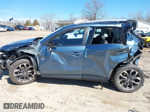 2016 Mazda CX-5 Grand Touring with VIN JM3KE2DY2G0715272, listed as a IAAI auction lot 41590492 with 134,176 mi miles. Bid and sale history available at carsss.com. Image 15.
