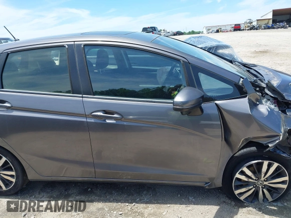 2016 Honda Fit EX z VIN JHMGK5H73GX031816, wystawiony jako IAAI lot #42295931 z przebiegiem Nie podano mil oraz . Historia ofert i sprzedaży dostępna na DreamBid. Obrazek 14.