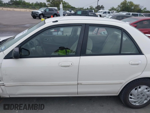 2000 Mazda Protege DX with VIN JM1BJ2220Y0273953, listed as a IAAI auction lot 41956058 with 158,837 mi miles and . Bid and sale history available at DreamBid. Image 14.