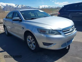 2012 Ford Taurus SEL z VIN 1FAHP2EW7CG115882, wystawiony jako IAAI lot #41963409 z przebiegiem 147 895 mil mil oraz . Historia ofert i sprzedaży dostępna na DreamBid. Obrazek 1.
