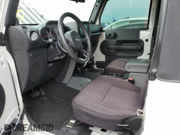 2009 Jeep Wrangler Rubicon with VIN 1J4GA64149L707142, listed as a Copart auction lot 76387344 with Not Provided miles and Salvage Title. Bid and sale history available at DreamBid. Image 7.