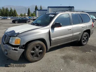 2005 GMC Envoy SLT with VIN 1GKDS13S952382088, listed as a Copart auction lot 64765154 with 177,333 mi miles and Salvage Title. Bid and sale history available at carsss.com. Image 1.