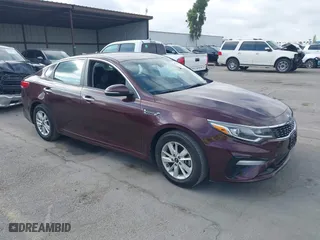 2019 Kia Optima LX with VIN 5XXGT4L36KG284965, listed as a IAAI auction lot 40374239 with 64,351 mi miles. Bid and sale history available at carsss.com. Image 1.