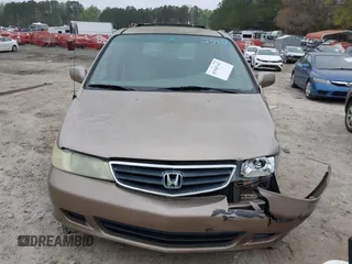 2004 Honda Odyssey EX with VIN 5FNRL18684B072343, listed as a IAAI auction lot 41945142 with 222,990 mi miles and . Bid and sale history available at DreamBid. Image 12.