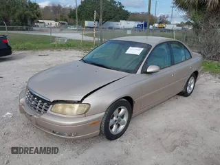 1998 Cadillac Catera z VIN W06VR52R3WR179841, wystawiony jako IAAI lot #41535621 z przebiegiem 103 204 mil mil oraz . Historia ofert i sprzedaży dostępna na DreamBid. Obrazek 2.