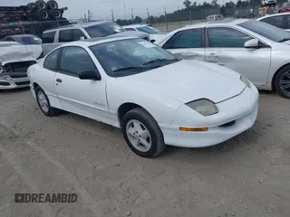 1999 Pontiac Sunfire SE z VIN 1G2JB1247X7582141, wystawiony jako IAAI lot #42198418 z przebiegiem Nie podano mil oraz . Historia ofert i sprzedaży dostępna na DreamBid. Obrazek 1.