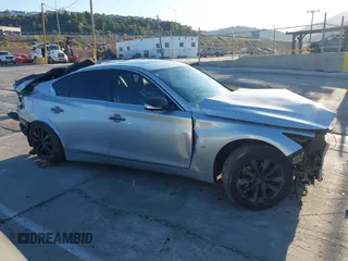 2015 Infiniti Q50 z VIN JN1BV7AP4FM341453, wystawiony jako IAAI lot #41755534 z przebiegiem Nie podano mil oraz . Historia ofert i sprzedaży dostępna na DreamBid. Obrazek 13.
