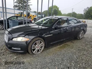2014 Jaguar XJ Portfolio with VIN SAJWJ2GD5E8V69982, listed as a Copart auction lot 58933515 with 92,847 mi miles and Salvage title. Bid and sale history available at DreamBid. Image 1.