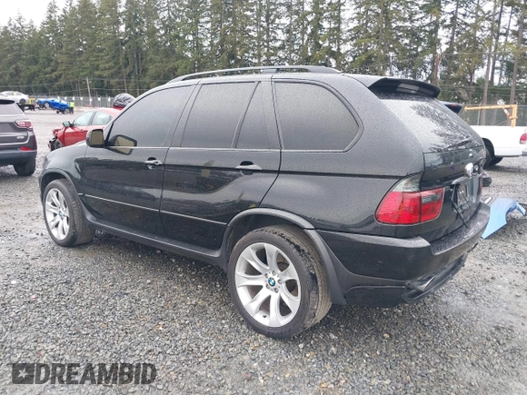2005 BMW X5 4.8is with VIN 5UXFA93515LE82570, listed as a IAAI auction lot 41759657 with 212,687 mi miles. Bid and sale history available at carsss.com. Image 3.