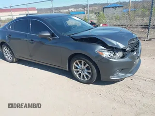 2016 Mazda 6 i Sport with VIN JM1GJ1U54G1413244, listed as a IAAI auction lot 42062416 with 148,970 mi miles and . Bid and sale history available at DreamBid. Image 1.