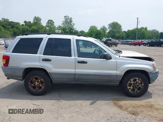 2002 Jeep Grand Cherokee Laredo with VIN 1J4GW48SX2C313093, listed as a IAAI auction lot 42446559 with 200,319 mi miles and . Bid and sale history available at DreamBid. Image 13.