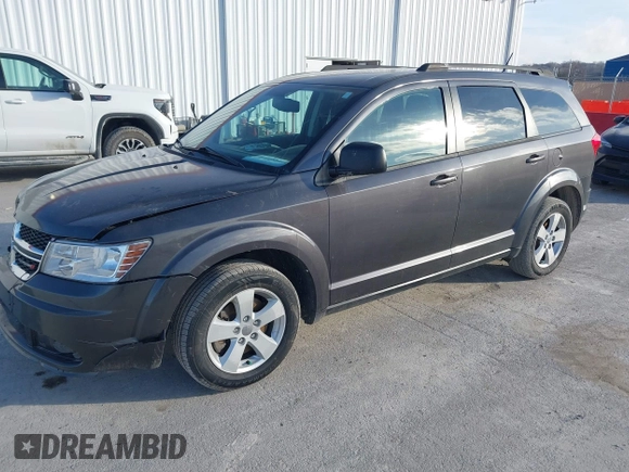 2014 Dodge Journey SE with VIN 3C4PDCAB0ET283756, listed as a IAAI auction lot 41490472 with 122,695 mi miles. Bid and sale history available at carsss.com. Image 2.