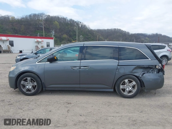 2012 Honda Odyssey Touring with VIN 5FNRL5H90CB045430, listed as a IAAI auction lot 42079770 with 113,901 mi miles and . Bid and sale history available at DreamBid. Image 15.