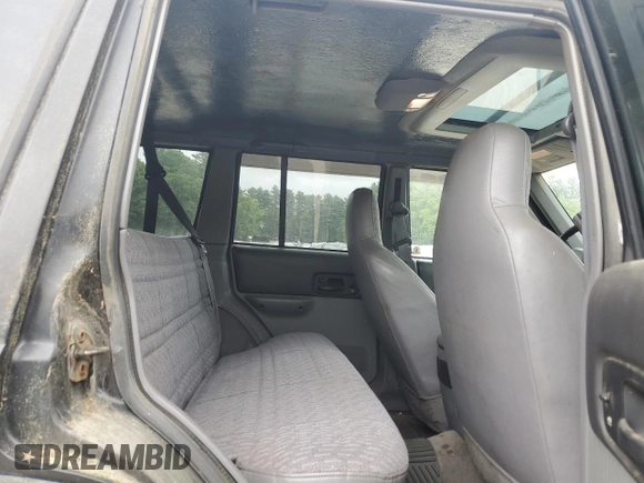 1998 Jeep Cherokee Sport z VIN 1J4FJ68S8WL183519, wystawiony jako Copart lot #60976335 z przebiegiem 161 536 mil mil oraz Czysty tytuł • Clean title. Historia ofert i sprzedaży dostępna na DreamBid. Obrazek 11.