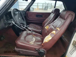 1988 Saab 900 z VIN YS3AT75L0J7015445, wystawiony jako Copart lot #77775074 z przebiegiem 225 073 mil mil oraz Szkoda całkowita • Salvage title. Historia ofert i sprzedaży dostępna na DreamBid. Obrazek 7.