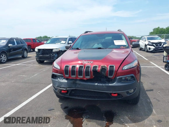 2014 Jeep Cherokee Trailhawk with VIN 1C4PJMBS7EW162357, listed as a IAAI auction lot 42601903 with 104,768 mi miles and . Bid and sale history available at DreamBid. Image 12.