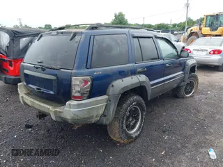 2001 Jeep Grand Cherokee Laredo z VIN 1J4GW48S91C698189, wystawiony jako IAAI lot #42315702 z przebiegiem 229 161 mil mil oraz . Historia ofert i sprzedaży dostępna na DreamBid. Obrazek 4.