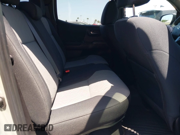 2023 Toyota Tacoma SR with VIN 3TMCZ5AN3PM590101, listed as a IAAI auction lot 42338670 with 12,970 mi miles and . Bid and sale history available at DreamBid. Image 8.