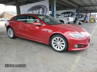 2017 Tesla Model S 100D with VIN 5YJSA1E29HF229425, listed as a Copart auction lot 54602195 with 128,886 mi miles and Salvage Title. Bid and sale history available at DreamBid. Image 4.