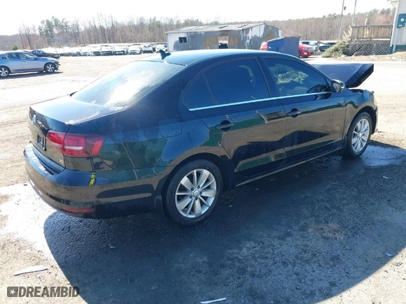 2016 Volkswagen Jetta Sedan 1.4T SE w/Connectivity with VIN 3VWD67AJ1GM369678, listed as a IAAI auction lot 41828693 with 110,964 mi miles. Bid and sale history available at carsss.com. Image 4.