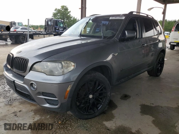 2012 BMW X5 35i with VIN 5UXZV4C56CL889802, listed as a Copart auction lot 62302265 with Not provided miles and Clean title. Bid and sale history available at DreamBid. Image 1.