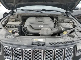 2014 Jeep Grand Cherokee Summit with VIN 1C4RJFJG1EC323658, listed as a Copart auction lot 50740115 with 253,656 mi miles and Salvage title. Bid and sale history available at DreamBid. Image 13.