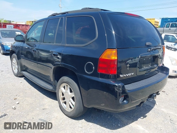 2006 GMC Envoy Denali with VIN 1GKES63M262344853, listed as a IAAI auction lot 42024960 with 183,066 mi miles. Bid and sale history available at carsss.com. Image 3.