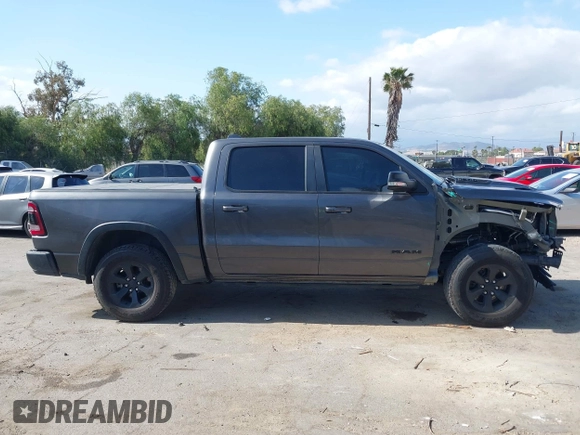 2019 Ram 1500 Rebel z VIN 1C6SRFLT2KN696557, wystawiony jako IAAI lot #42110931 z przebiegiem 81 372 mil mil oraz . Historia ofert i sprzedaży dostępna na DreamBid. Obrazek 13.