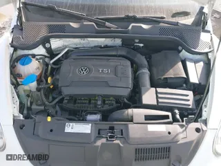 2016 Volkswagen Beetle Coupe 1.8T Wolfsburg Edition with VIN 3VWF17AT0GM607755, listed as a IAAI auction lot 41508585 with 52,913 mi miles. Bid and sale history available at carsss.com. Image 10.