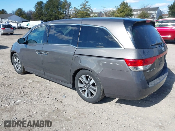2016 Honda Odyssey Touring Elite with VIN 5FNRL5H90GB128006, listed as a IAAI auction lot 41695438 with 133,337 mi miles. Bid and sale history available at carsss.com. Image 3.
