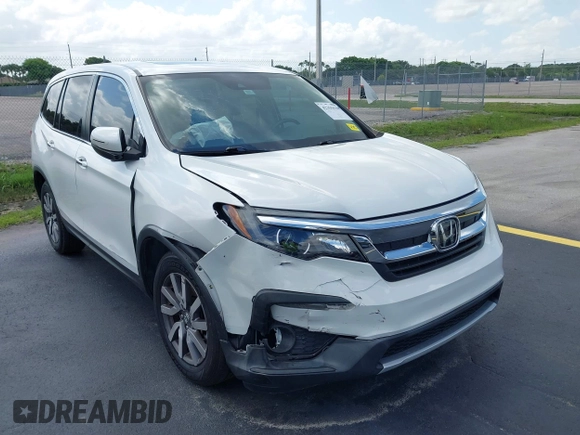 2020 Honda Pilot EX-L with VIN 5FNYF5H59LB028268, listed as a IAAI auction lot 42355620 with 107,033 mi miles and . Bid and sale history available at DreamBid. Image 6.