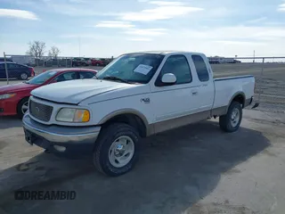 2001 Ford F-150 XL with VIN 1FTRX18LX1KA49557, listed as a IAAI auction lot 41875941 with 192,202 mi miles. Bid and sale history available at carsss.com. Image 2.