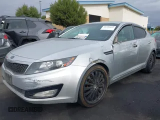 2013 Kia Optima LX with VIN KNAGM4A75D5430974, listed as a IAAI auction lot 41209055 with 197,871 mi miles. Bid and sale history available at carsss.com. Image 2.