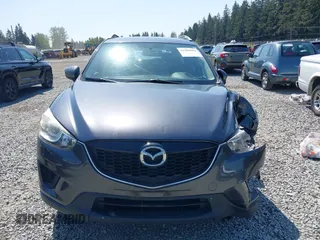 2015 Mazda CX-5 Sport z VIN JM3KE4BY5F0540612, wystawiony jako IAAI lot #42109082 z przebiegiem 83 874 mil mil oraz . Historia ofert i sprzedaży dostępna na DreamBid. Obrazek 13.