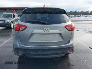 2014 Mazda CX-5 Grand Touring with VIN JM3KE2DY8E0304911, listed as a IAAI auction lot 41672197 with 77,523 mi miles. Bid and sale history available at carsss.com. Image 16.