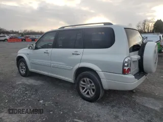 2004 Suzuki XL7 LX z VIN JS3TX92V544113433, wystawiony jako Copart lot #84066144 z przebiegiem 164 390 mil mil oraz Szkoda całkowita • Salvage title. Historia ofert i sprzedaży dostępna na DreamBid. Obrazek 2.