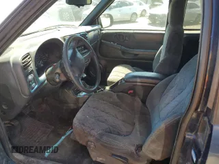 2000 GMC Sonoma SLS z VIN 1GTCS19W0Y8206050, wystawiony jako Copart lot #49122164 z przebiegiem 264 070 mil mil oraz Szkody całkowita. Historia ofert i sprzedaży dostępna na DreamBid. Obrazek 7.